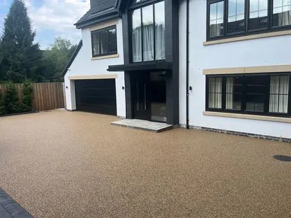 Golden resin bound driveway outside a modern detached house